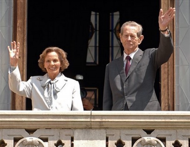 Former Romanian King Michael I, right, and his wife Ana, left, wave from the balcony of the Peles Castle, in Sinaia, Romania, which was officialy returned to the royal family Thursday June 5 2008. Michael I, who is 86, says his return to Peles Castle a 160-room palace in the Carpathian Mountains rights a historic wrong. Michael was born on the estate and spent most of his childhood there. The palace was confiscated when the Communist regime forced him to abdicate in 1947.(AP Photo/Paul Buciuta)
