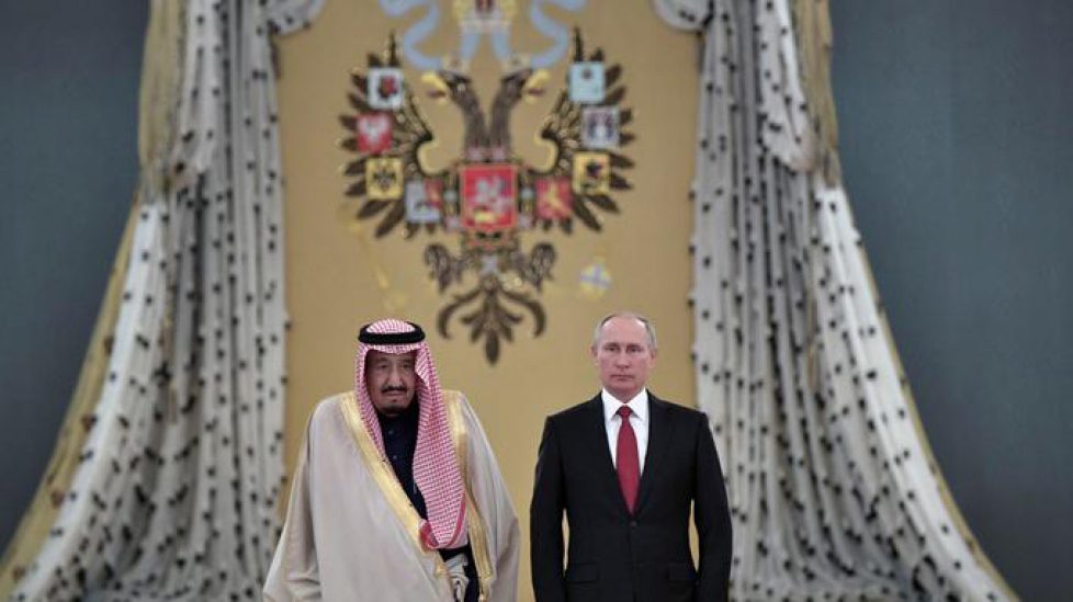 Russian President Vladimir Putin and Saudi Arabia's King Salman attend a welcoming ceremony ahead of their talks in the Kremlin in Moscow