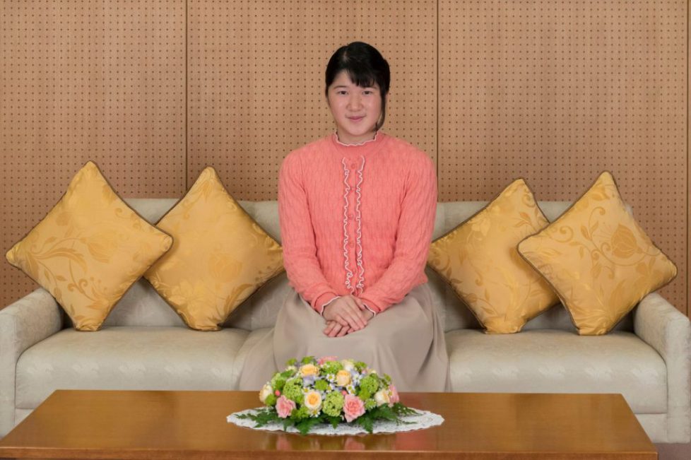 Japan's Princess Aiko talks with her father Crown Prince Naruhito about her school trip at Togu Palace in Tokyo, Japan, in this handout photo