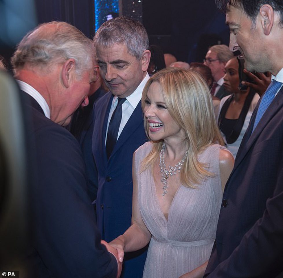 6098622-6381715-Prince_Charles_met_with_Kylie_Minogue_as_he_attended_the-a-61_1542054878796