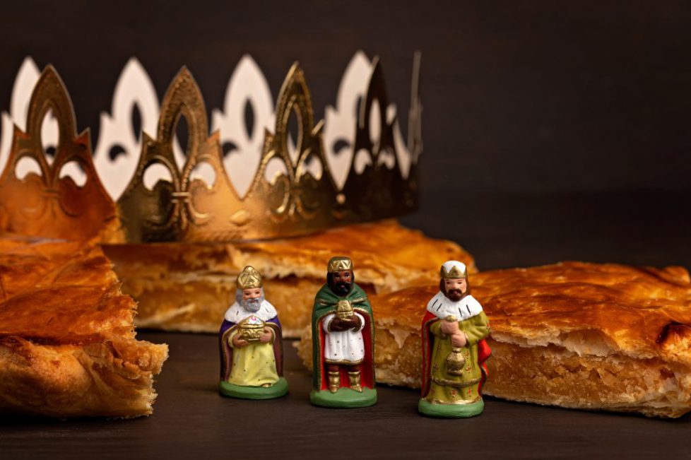King cake or galette des rois in French. Traditional epiphany pie with golden paper crown and charm