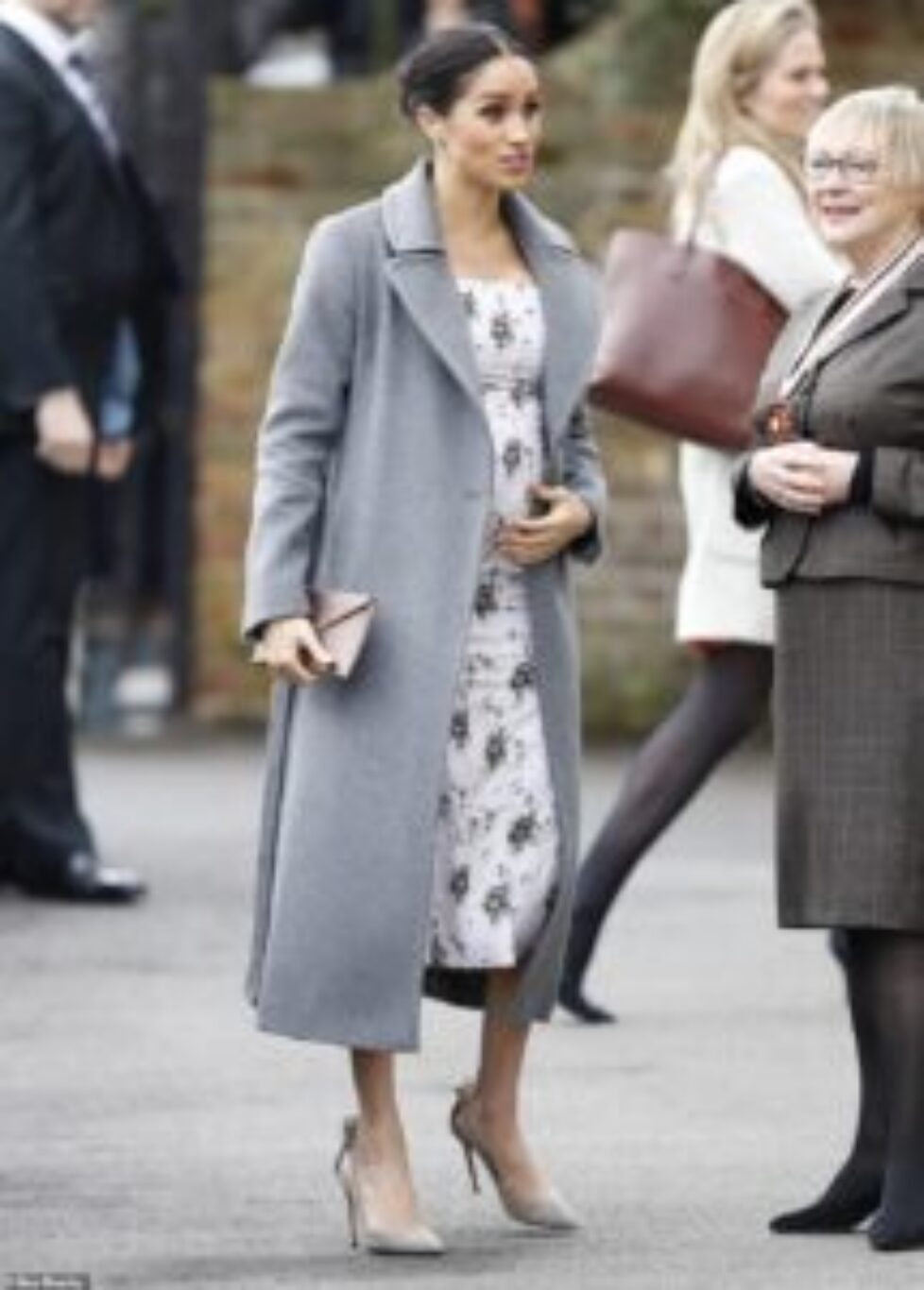 7563844-6507331-The_pregnant_Duchess_of_Sussex_was_blooming_today_as_she_arrived-m-65_1545138575806