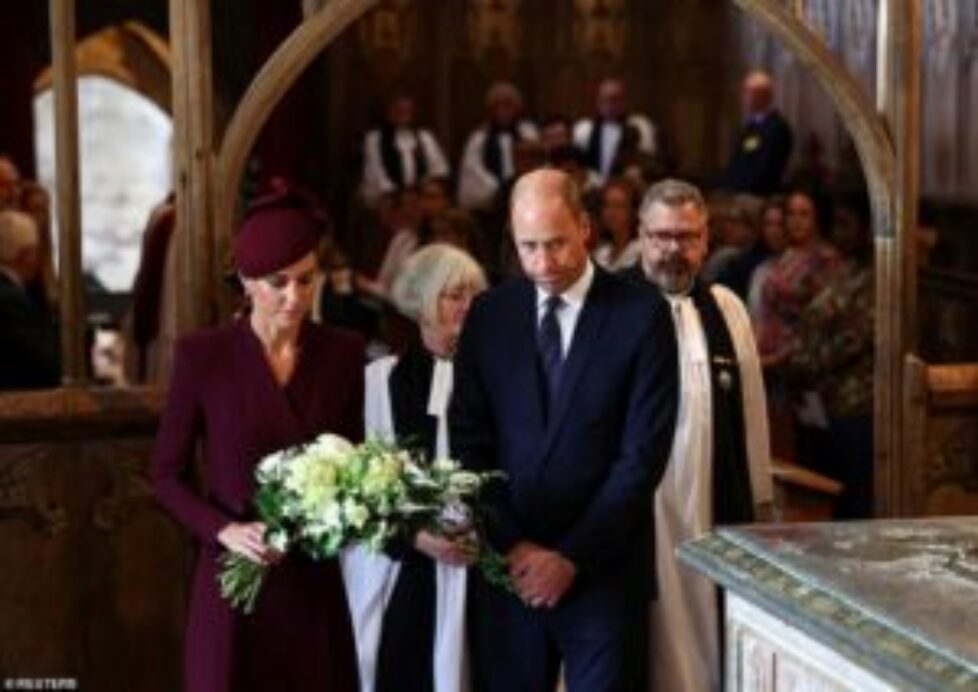 75215509-12495721-Prince_William_and_Kate_walk_forward_to_place_flowers_next_to_a_-a-2_1694190250984